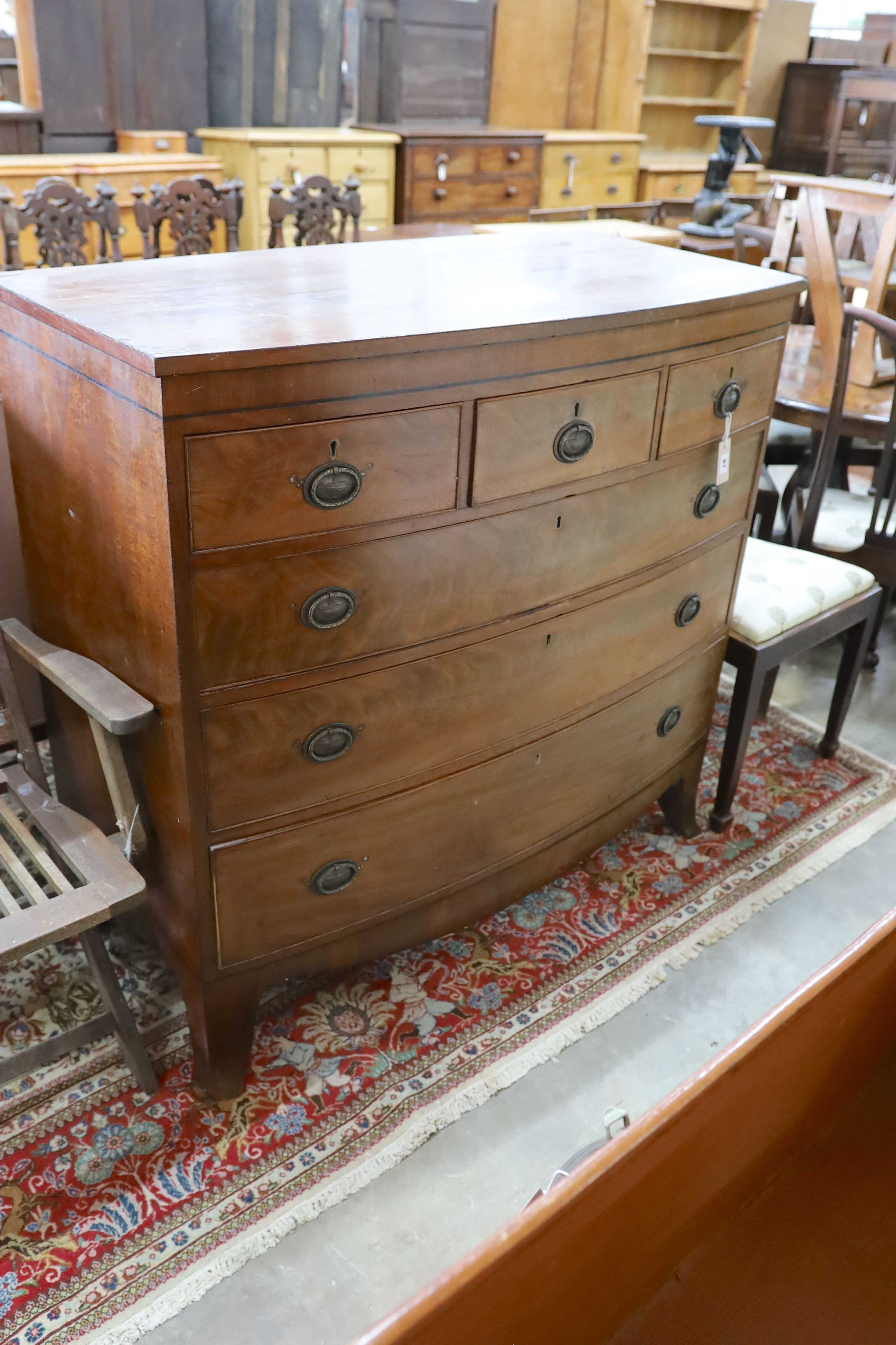 A Georgian mahogany bow fronted chest, fitted three short drawers and three long drawers on splayed bracket feet, width 115cm, depth 56cm, height 111cm